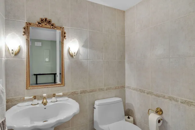 a view of a dining room with furniture and a large window