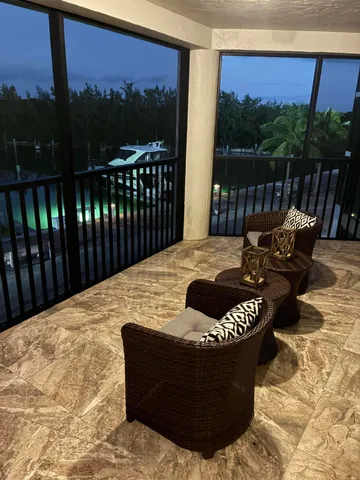 a view of a swimming pool and lounge chair