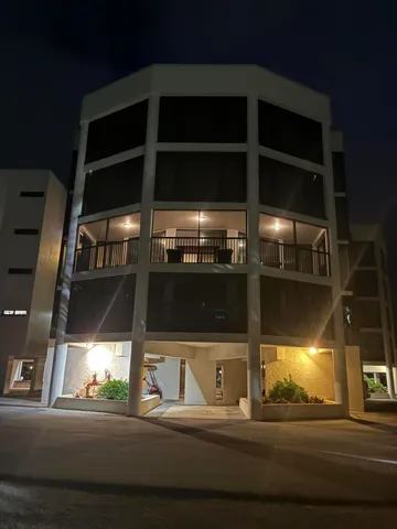 a kitchen with stainless steel appliances kitchen island granite countertop a table and chairs