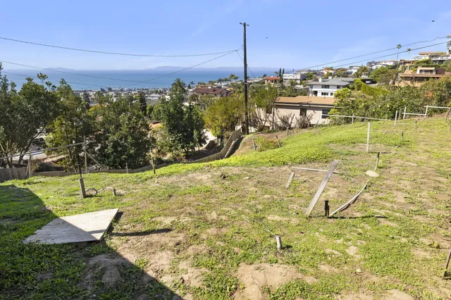 a view of a swimming pool with a yard