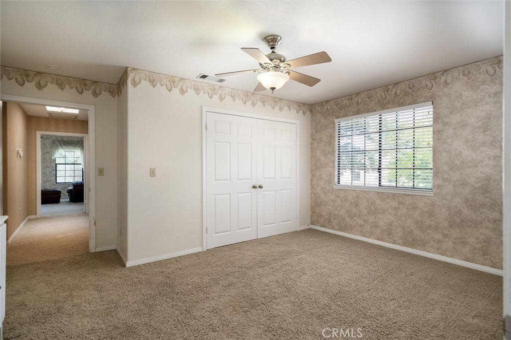 34150 Stowe Road Winchester, CA 92545 - Photo 35 of 80 an empty room with fan and windows
