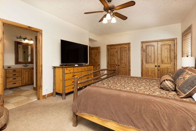 382 Ridgeview Street, Unit 8 & 9 Brian Head, UT 84719 - Photo 37 of 52 Spacious room featuring carpeting, a ceiling fan, and solid wood double doors