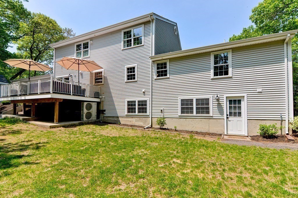 9 Woodcliff Road Canton, MA 02021 - Photo 16 of 42 a front view of house with yard