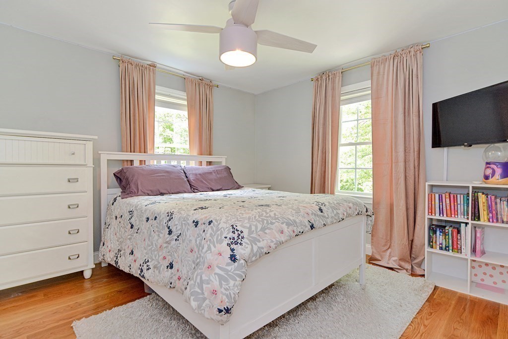 9 Woodcliff Road Canton, MA 02021 - Photo 22 of 42 a bedroom with a bed and a flat screen tv