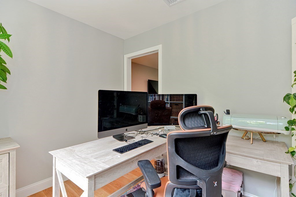 9 Woodcliff Road Canton, MA 02021 - Photo 29 of 42 a kitchen with a stove a microwave a sink and a dining table