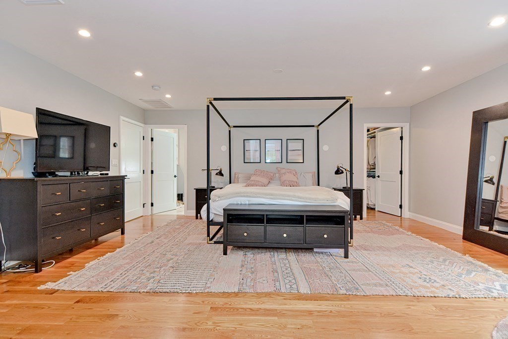 9 Woodcliff Road Canton, MA 02021 - Photo 31 of 42 a spacious bedroom with a bed and a flat screen tv