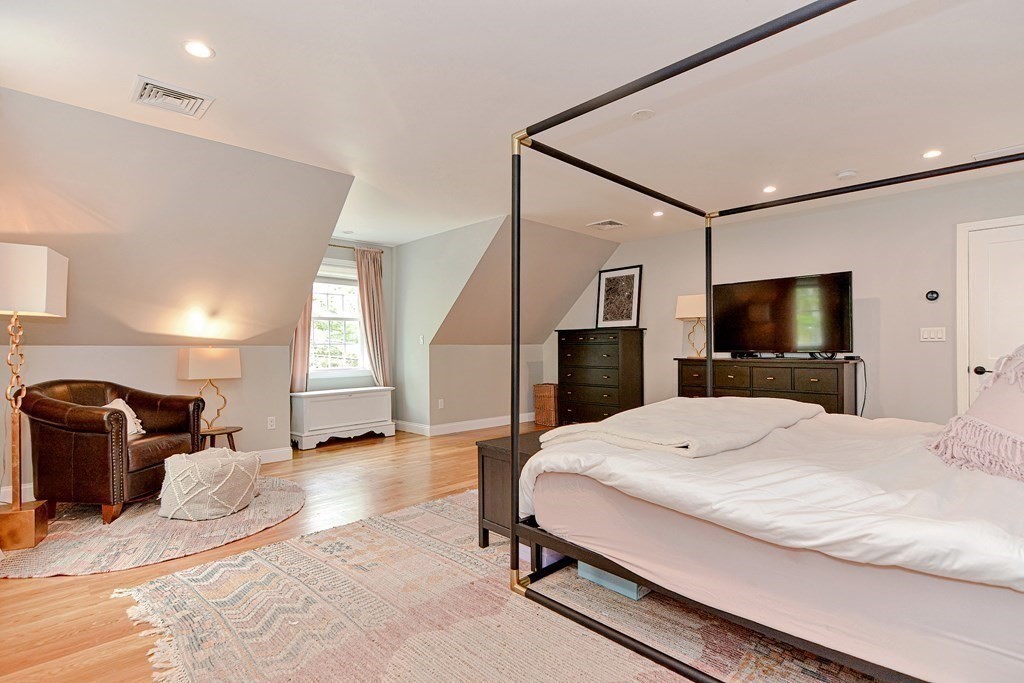 9 Woodcliff Road Canton, MA 02021 - Photo 32 of 42 a room with a bed and a television in it