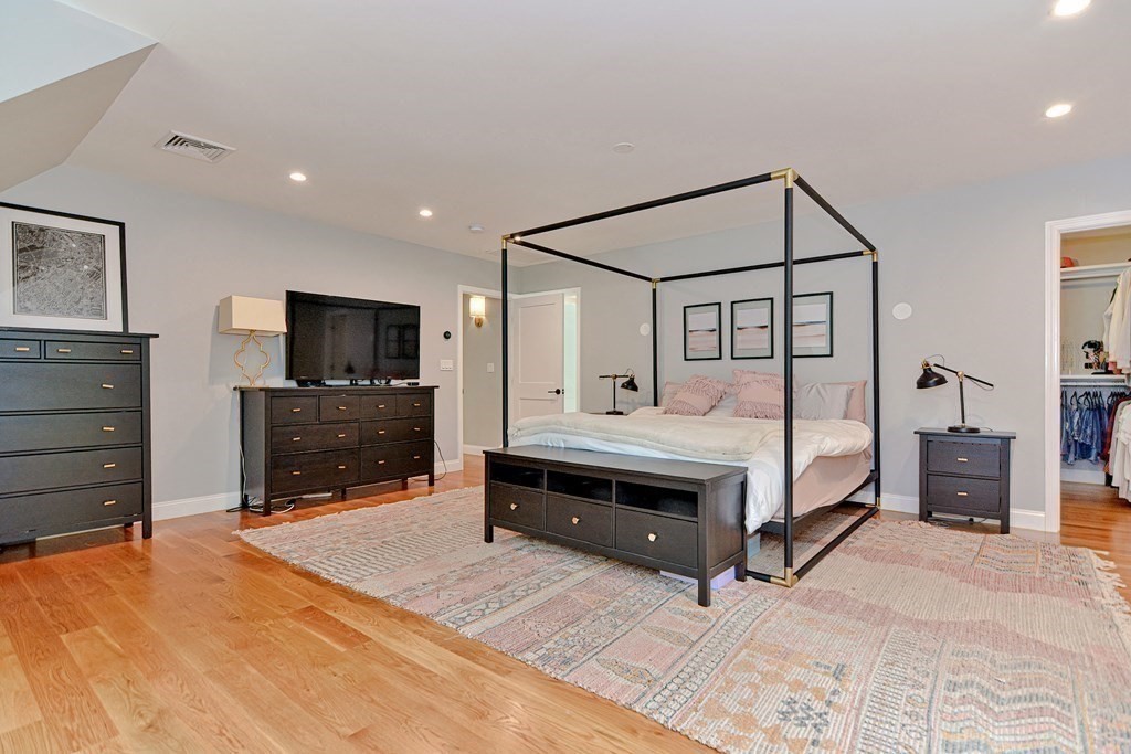 9 Woodcliff Road Canton, MA 02021 - Photo 33 of 42 a spacious bedroom with a bed and a flat screen tv