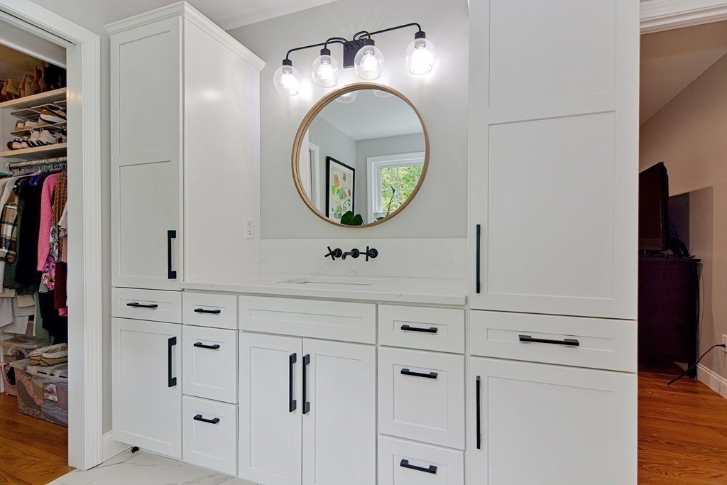 9 Woodcliff Road Canton, MA 02021 - Photo 34 of 42 a bathroom with cabinets and a mirror
