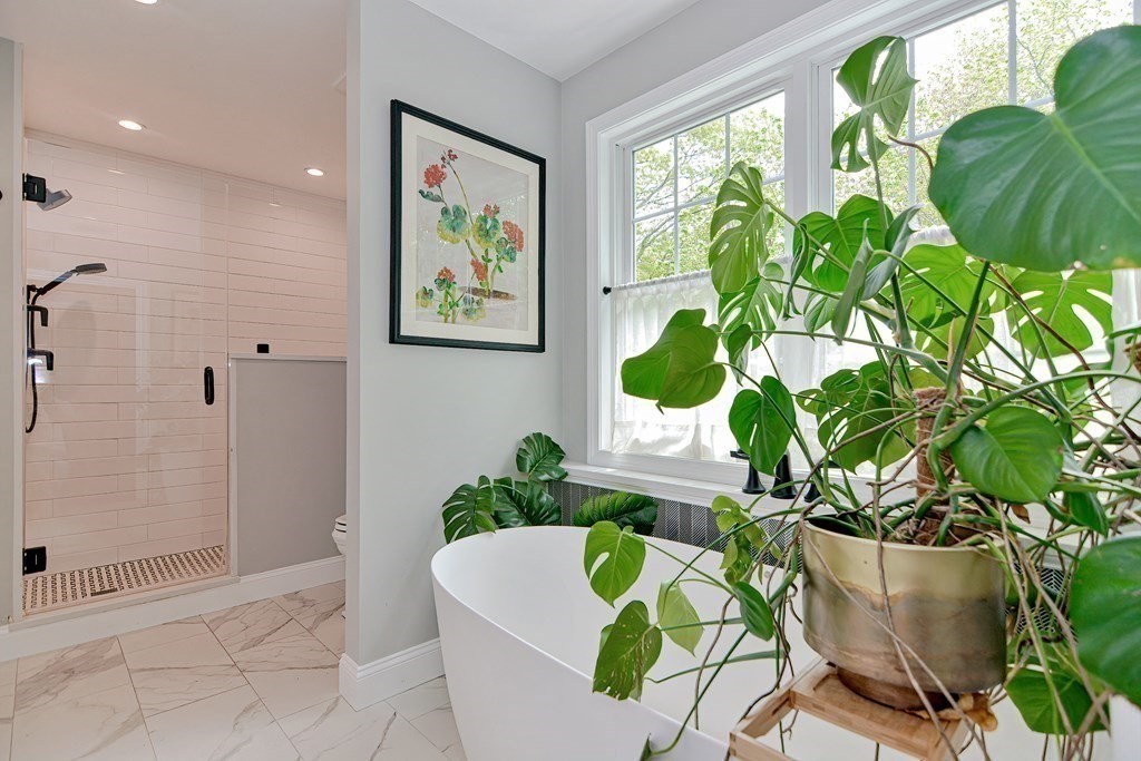 9 Woodcliff Road Canton, MA 02021 - Photo 35 of 42 a white bath tub sitting in a bathroom next to a tub