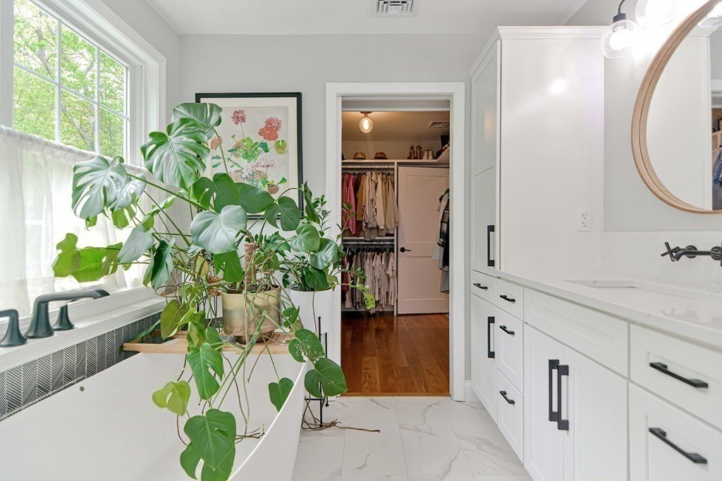 9 Woodcliff Road Canton, MA 02021 - Photo 36 of 42 a bathroom with a sink a mirror and a shower