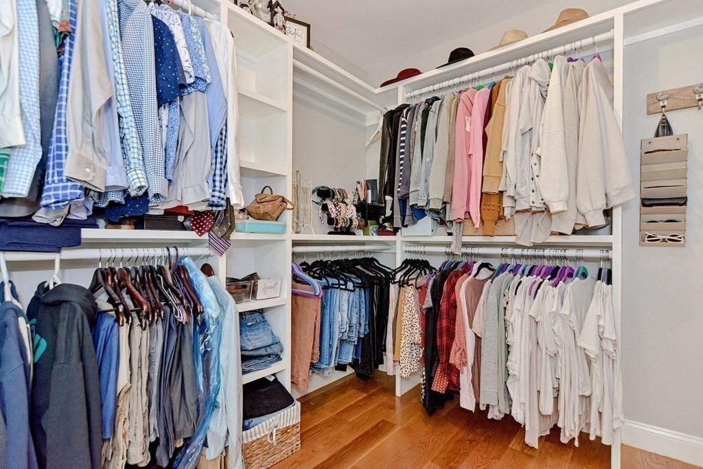 9 Woodcliff Road Canton, MA 02021 - Photo 37 of 42 a view of walk in closet with clothes and shoes