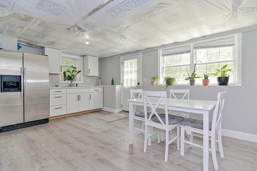9 Woodcliff Road Canton, MA 02021 - Photo 40 of 42 a large kitchen with a table and chairs