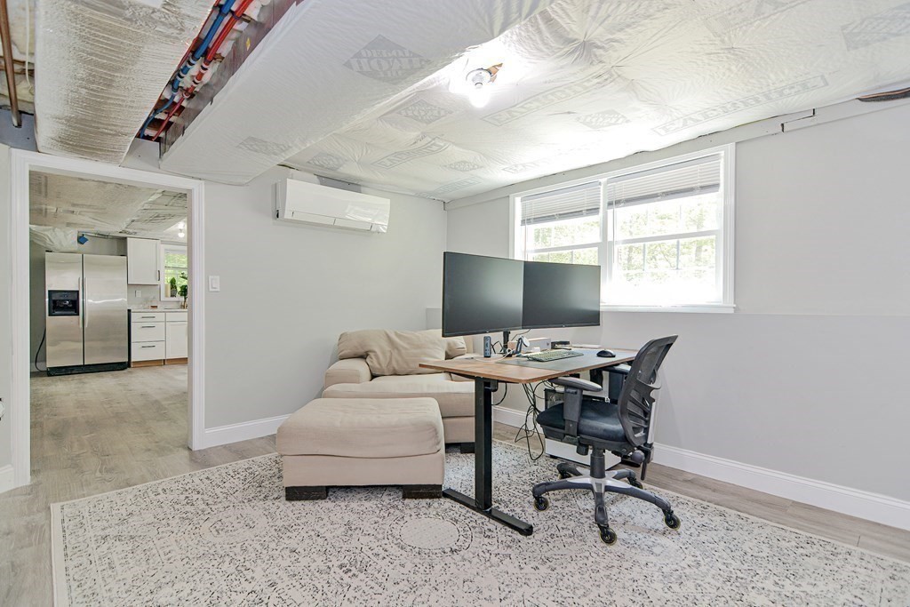 9 Woodcliff Road Canton, MA 02021 - Photo 42 of 42 a living room with furniture a flat screen tv and a window