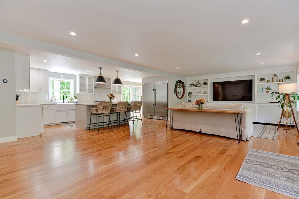 9 Woodcliff Road Canton, MA 02021 - Photo 5 of 42 a living room with furniture and a flat screen tv