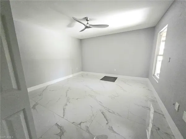 en empty room with windows