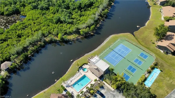 an aerial view of a house with a lake view