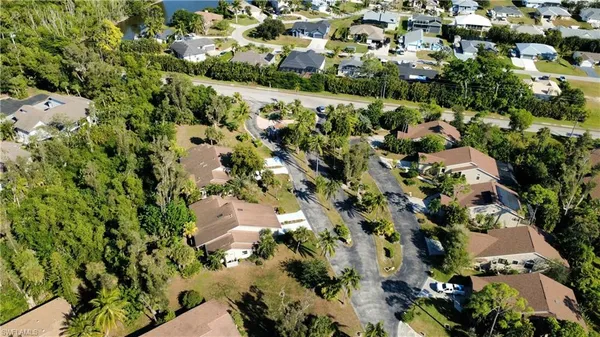 an aerial view of residential houses with outdoor space