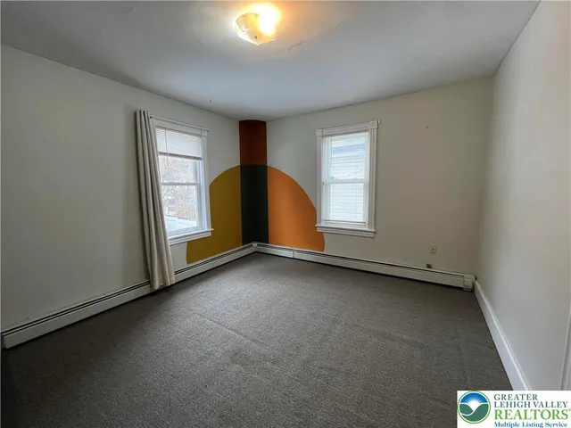 a view of an empty room with a window