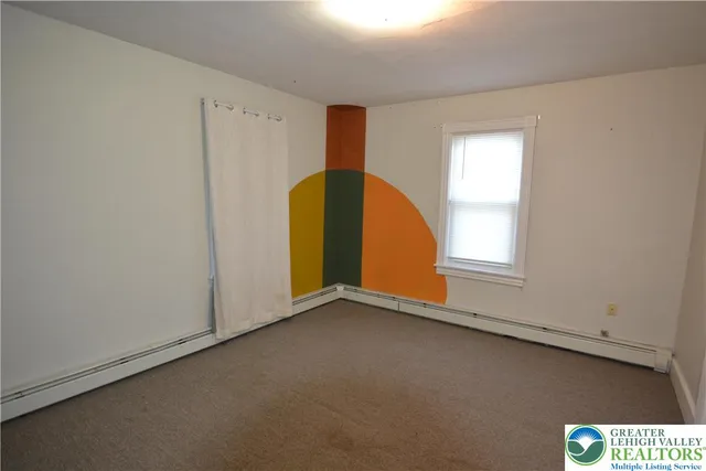 a view of room with stairs and a chandelier fan