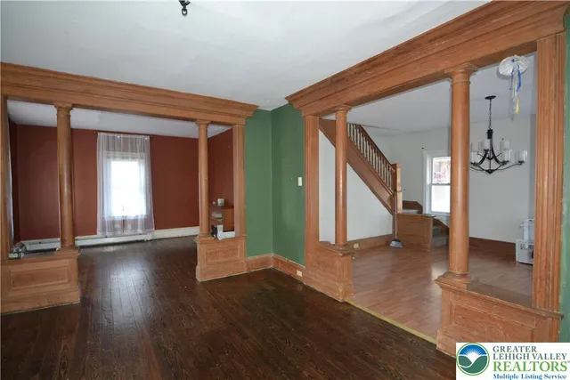 wooden floor in a hall with an entryway