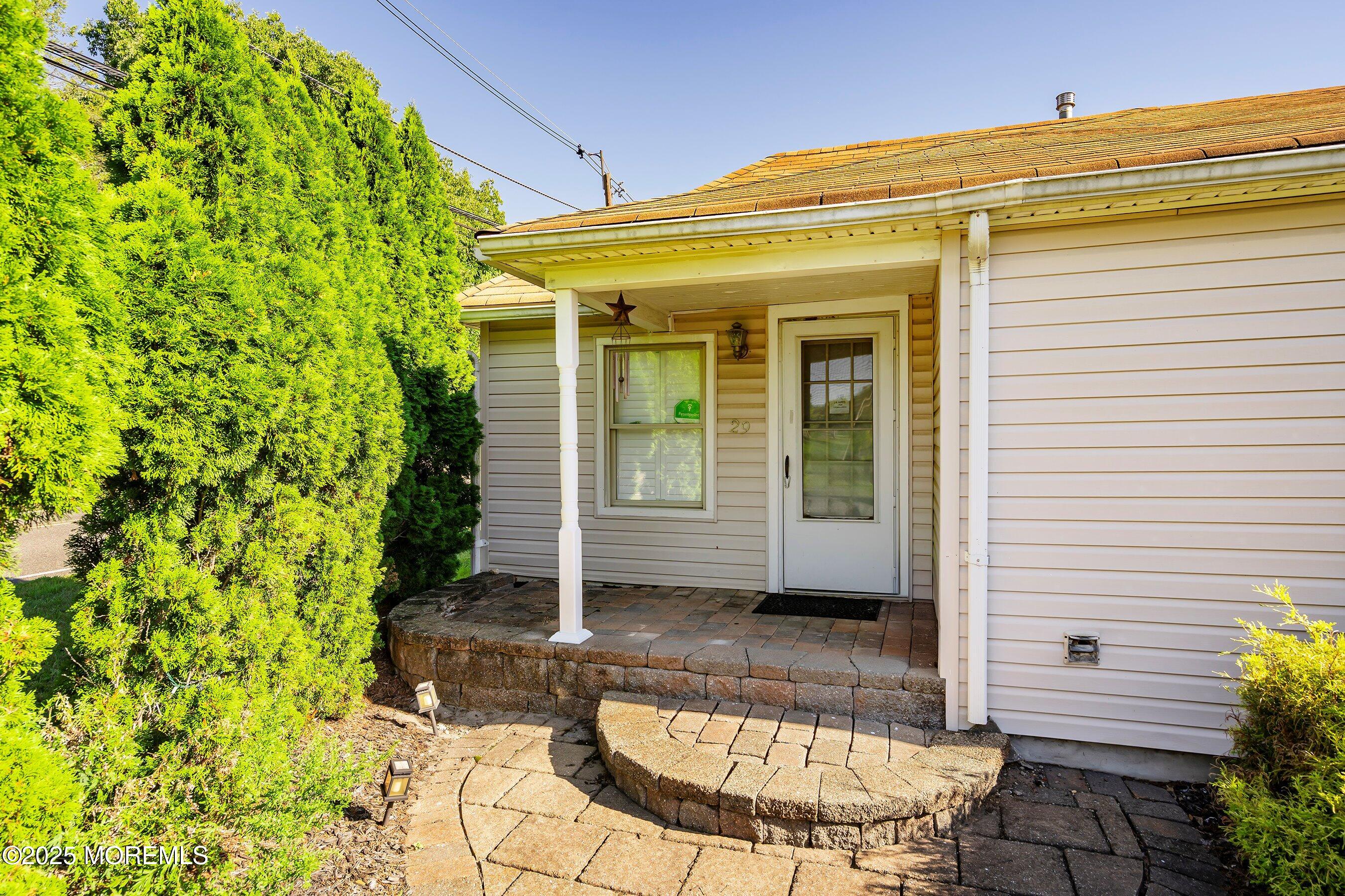 29 Ford Road Howell, NJ 07731 - Photo 16 of 19 a view of a house with potted plants