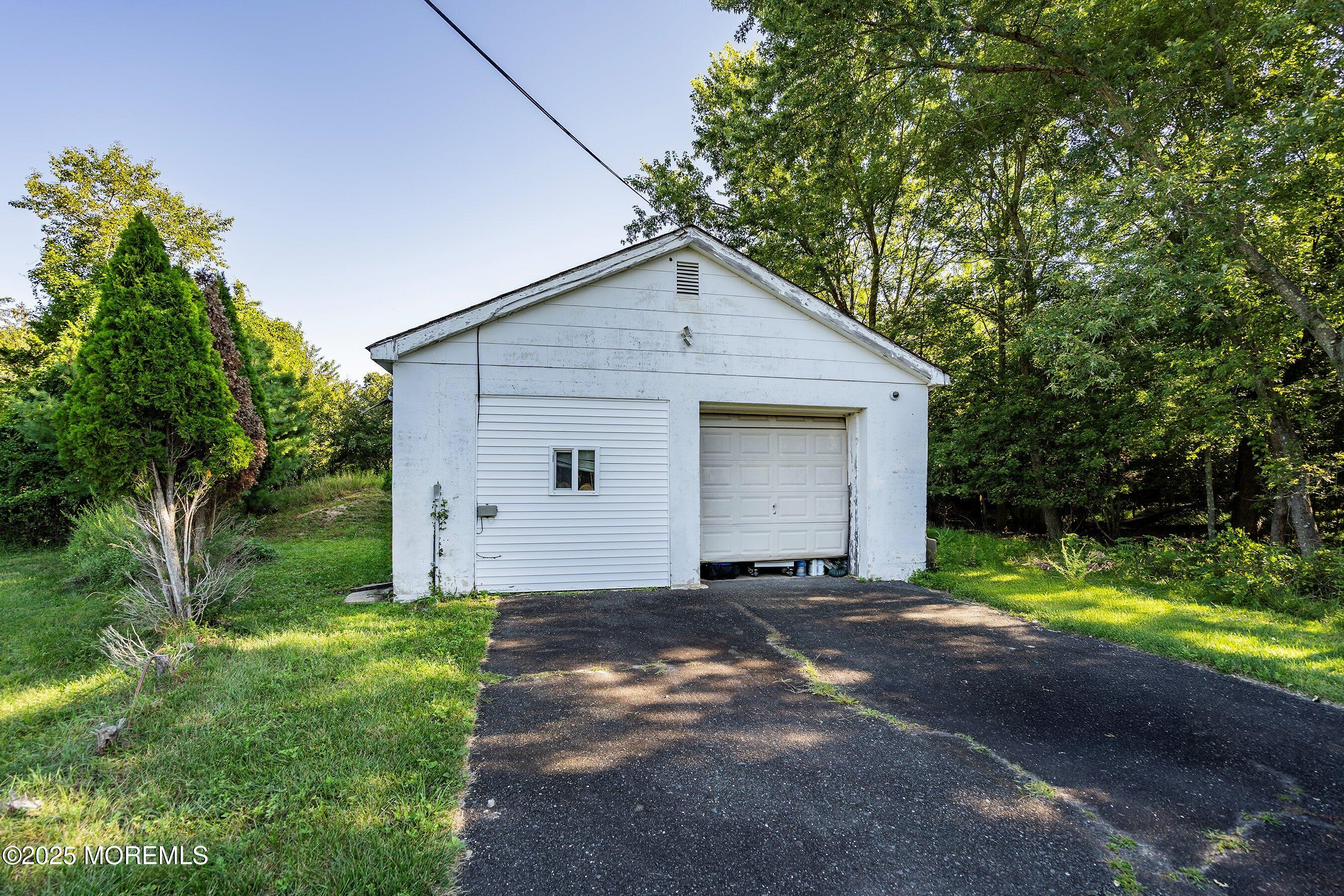29 Ford Road Howell, NJ 07731 - Photo 5 of 19 a view of a house with a yard and large tree