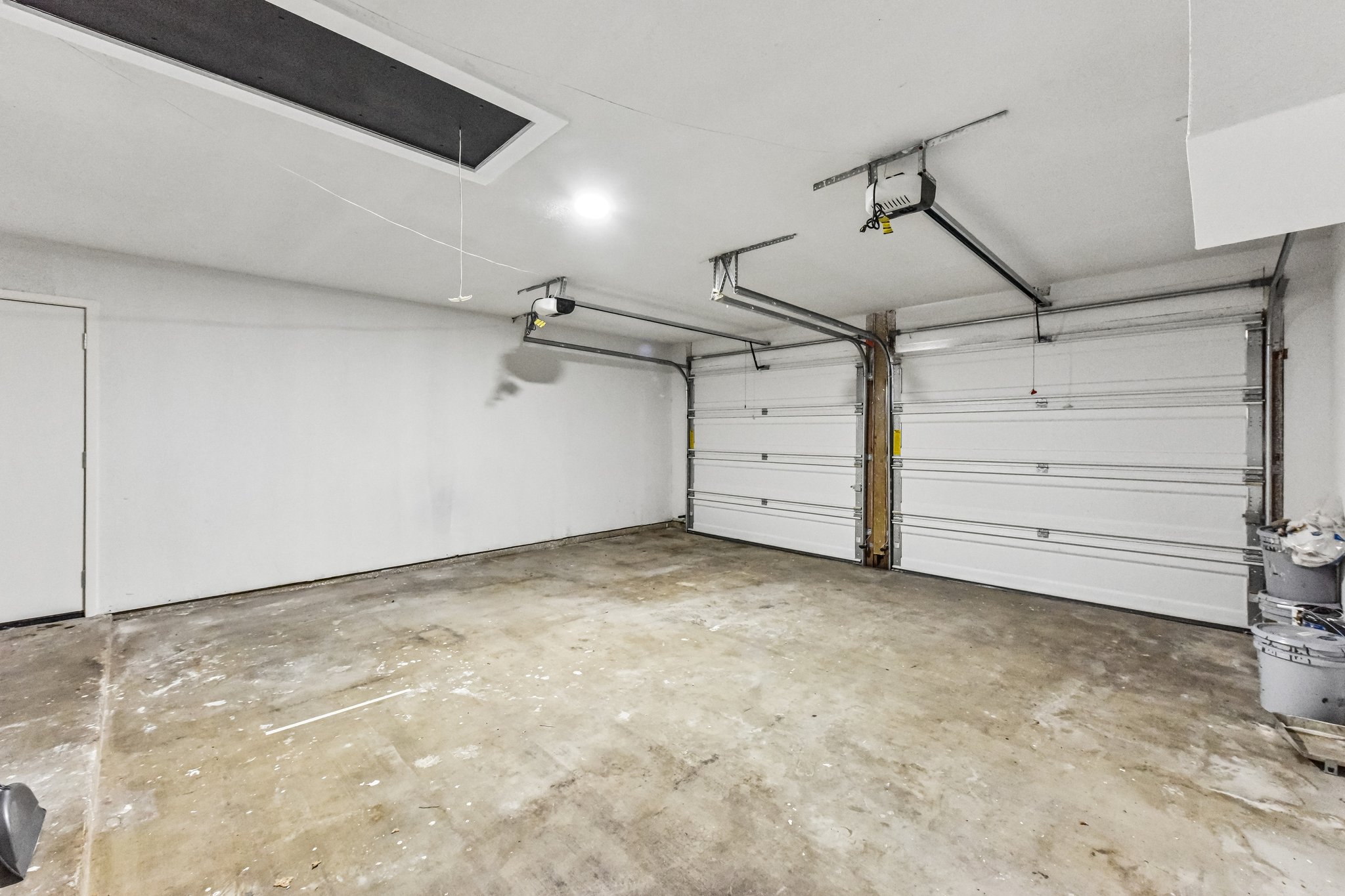 7523 Glenhill Road Austin, TX 78752 - Photo 31 of 38 A spacious, well-lit two-car garage provides ample parking and storage.