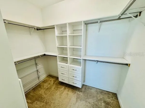 a view of an empty walk in closet