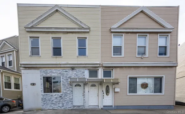 a front view of a house with a garage