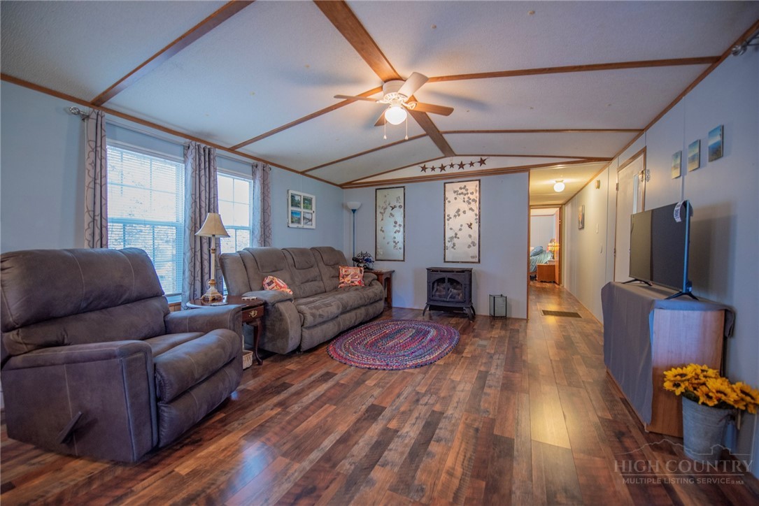 1848 West Mill Creek Road Warrensville, NC 28693 - Photo 13 of 50 a living room with furniture and a flat screen tv