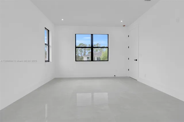 an empty room with white walls and white walls