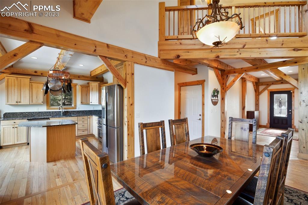 1201 County Road 512 Divide, CO 80814 - Photo 15 of 43 a view of a dining room with furniture and wooden floor