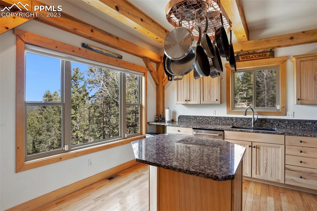 1201 County Road 512 Divide, CO 80814 - Photo 19 of 43 a kitchen with granite countertop a sink a counter top space and cabinets