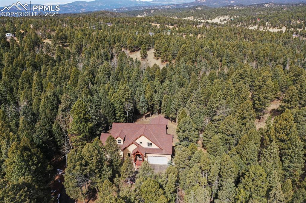 1201 County Road 512 Divide, CO 80814 - Photo 2 of 43 an aerial view of residential houses with outdoor space and trees
