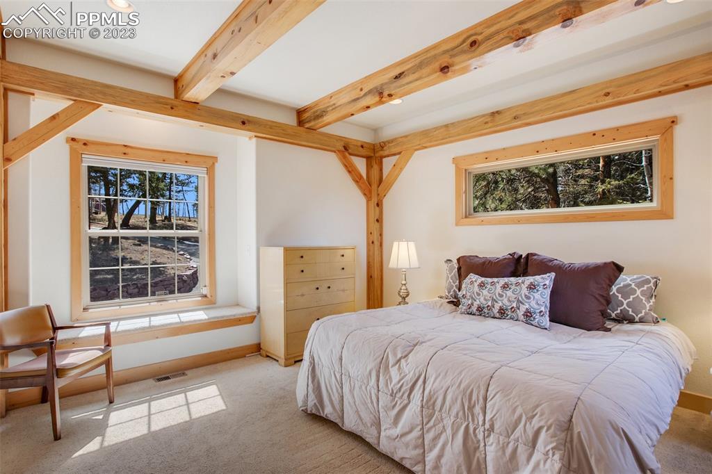 1201 County Road 512 Divide, CO 80814 - Photo 24 of 43 a bedroom with a bed and a window