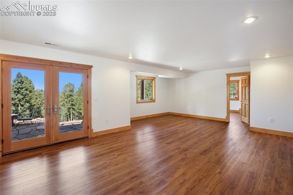 1201 County Road 512 Divide, CO 80814 - Photo 34 of 43 a view of an empty room with wooden floor and a window