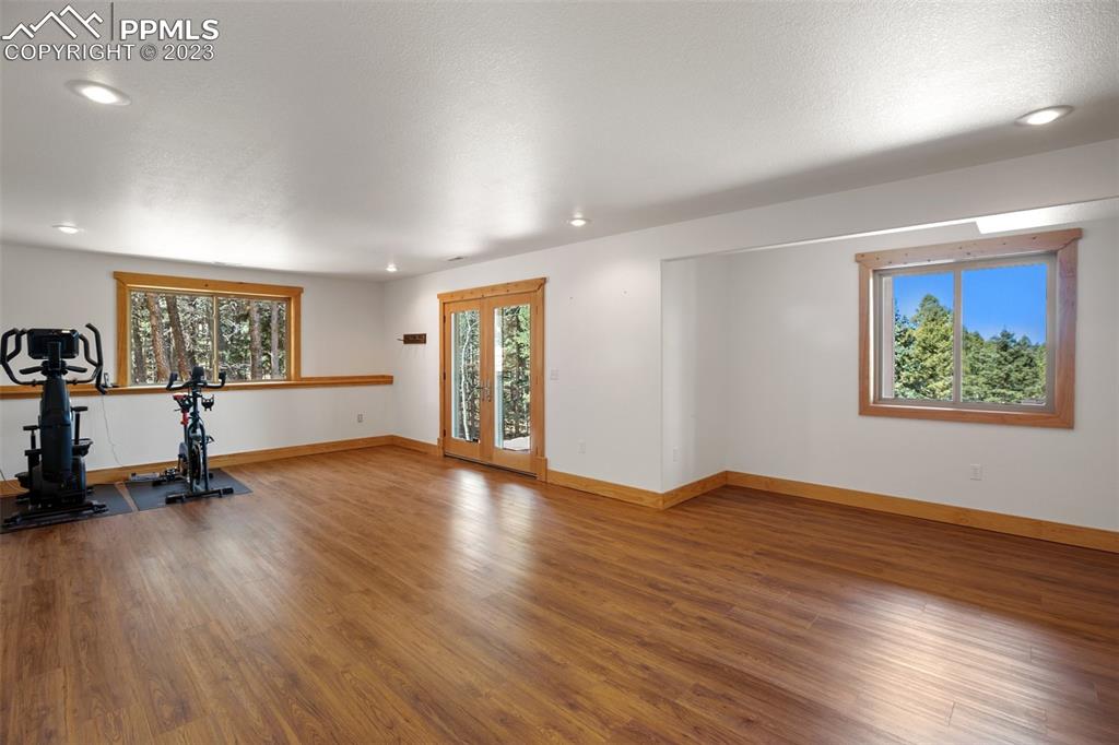 1201 County Road 512 Divide, CO 80814 - Photo 35 of 43 a view of an empty room with a window and wooden floor