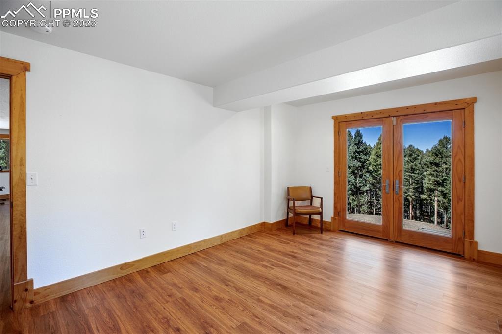 1201 County Road 512 Divide, CO 80814 - Photo 37 of 43 an empty room with wooden floor and a window