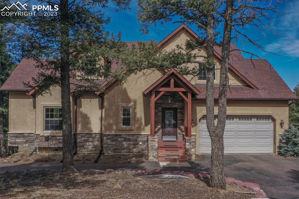 1201 County Road 512 Divide, CO 80814 - Photo 4 of 43 a front view of a house with garage