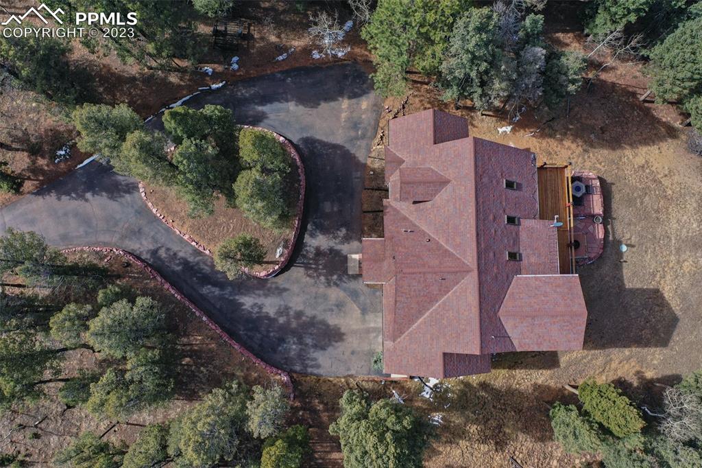1201 County Road 512 Divide, CO 80814 - Photo 8 of 43 an aerial view of a house with a yard and a large tree