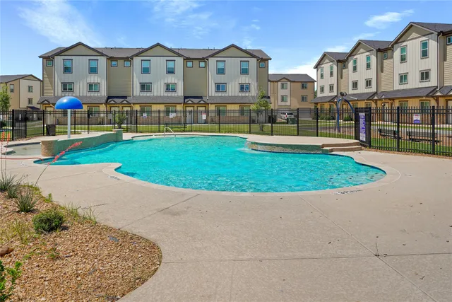 a view of multiple houses with a yard