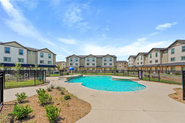 a view of a house with swimming pool