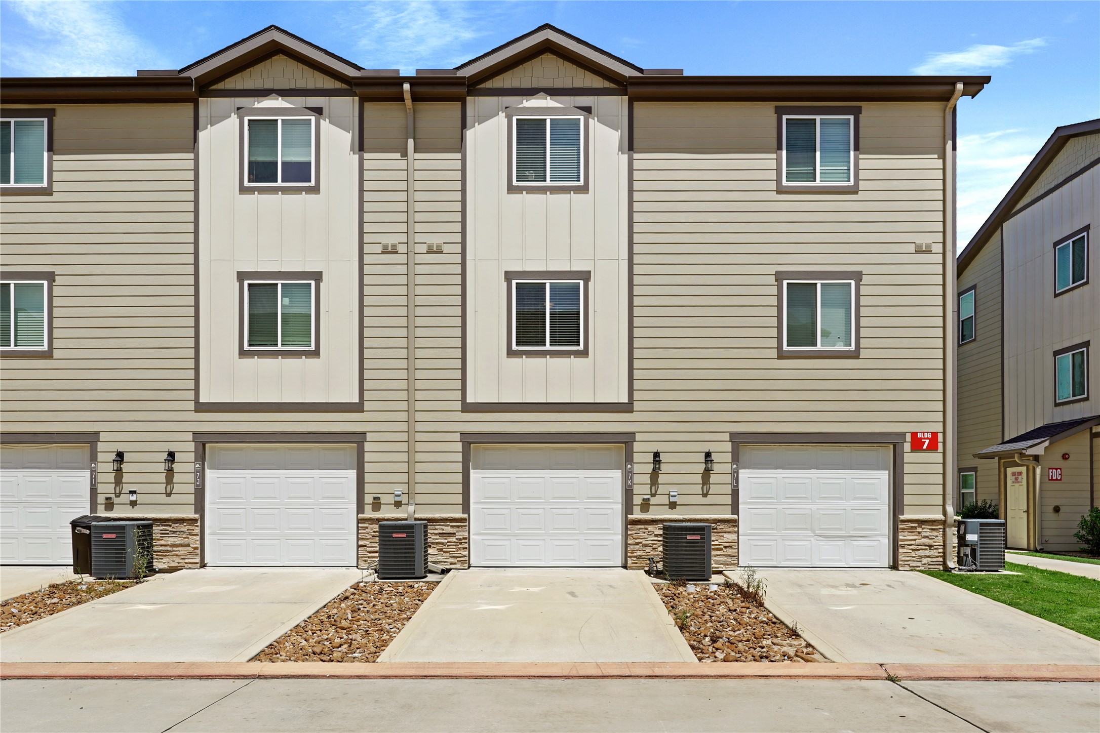 12603 Telge Road, Unit 7L Cypress, TX 77429 - Photo 4 of 20 a front view of a house with yard