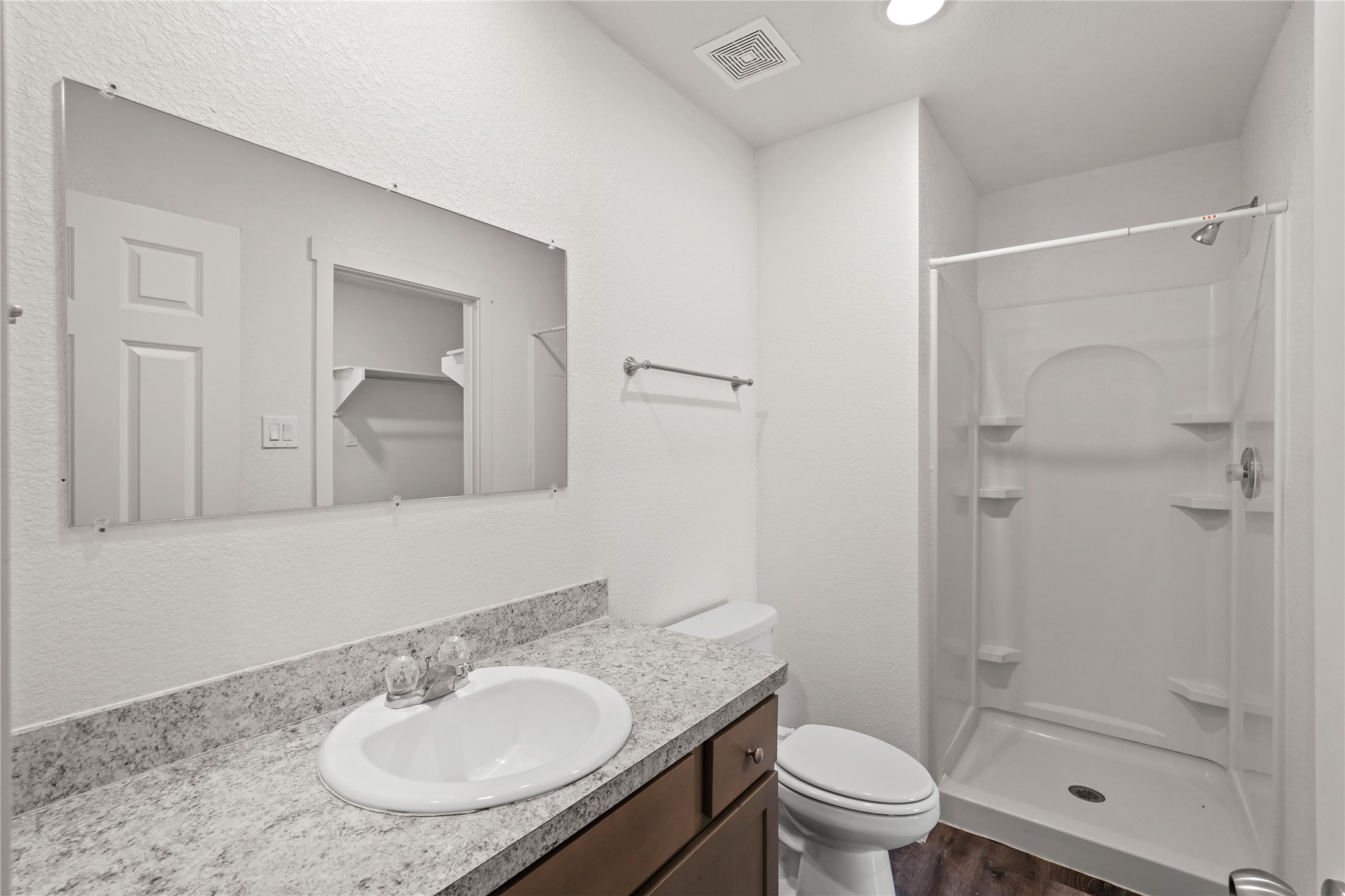 12603 Telge Road, Unit 7L Cypress, TX 77429 - Photo 6 of 20 a bathroom with a sink toilet a mirror and shower