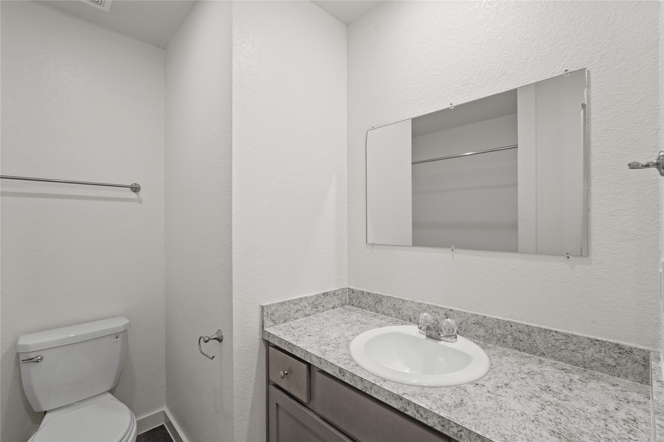 12603 Telge Road, Unit 7L Cypress, TX 77429 - Photo 8 of 20 a bathroom with a granite countertop sink toilet and a mirror