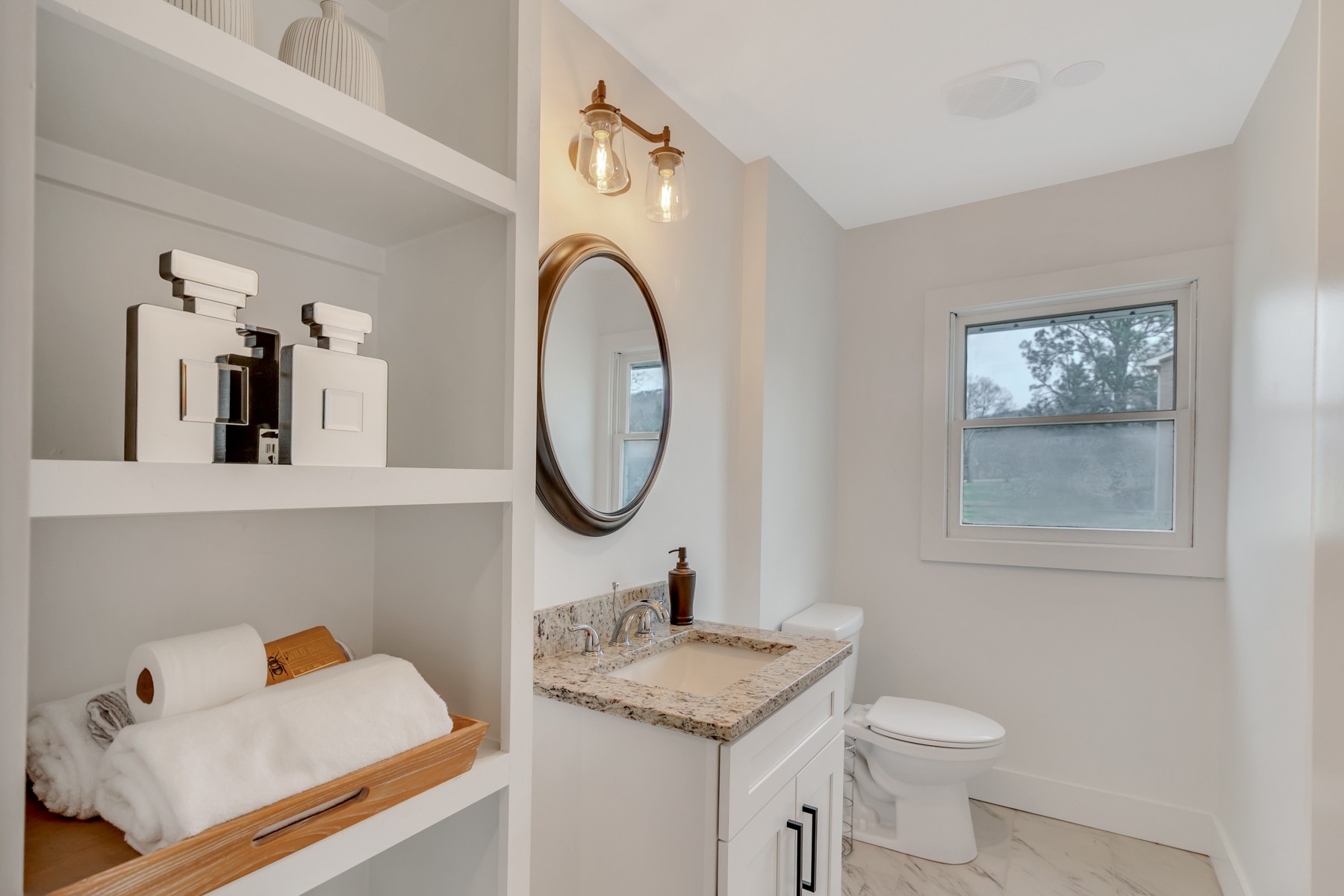 4778 Drakes Branch Road Nashville, TN 37218 - Photo 13 of 17 a bathroom with a sink mirror and toilet