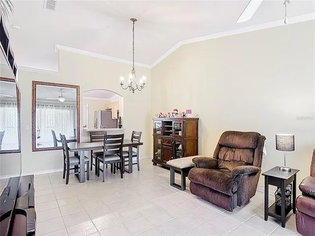 a view of a livingroom with furniture and chandelier