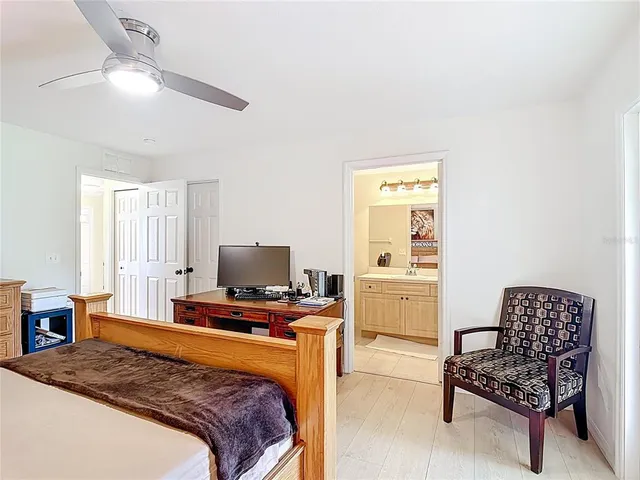 a bedroom with a bed and furniture