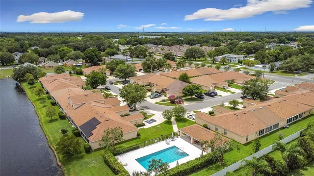 an aerial view of residential houses with outdoor space
